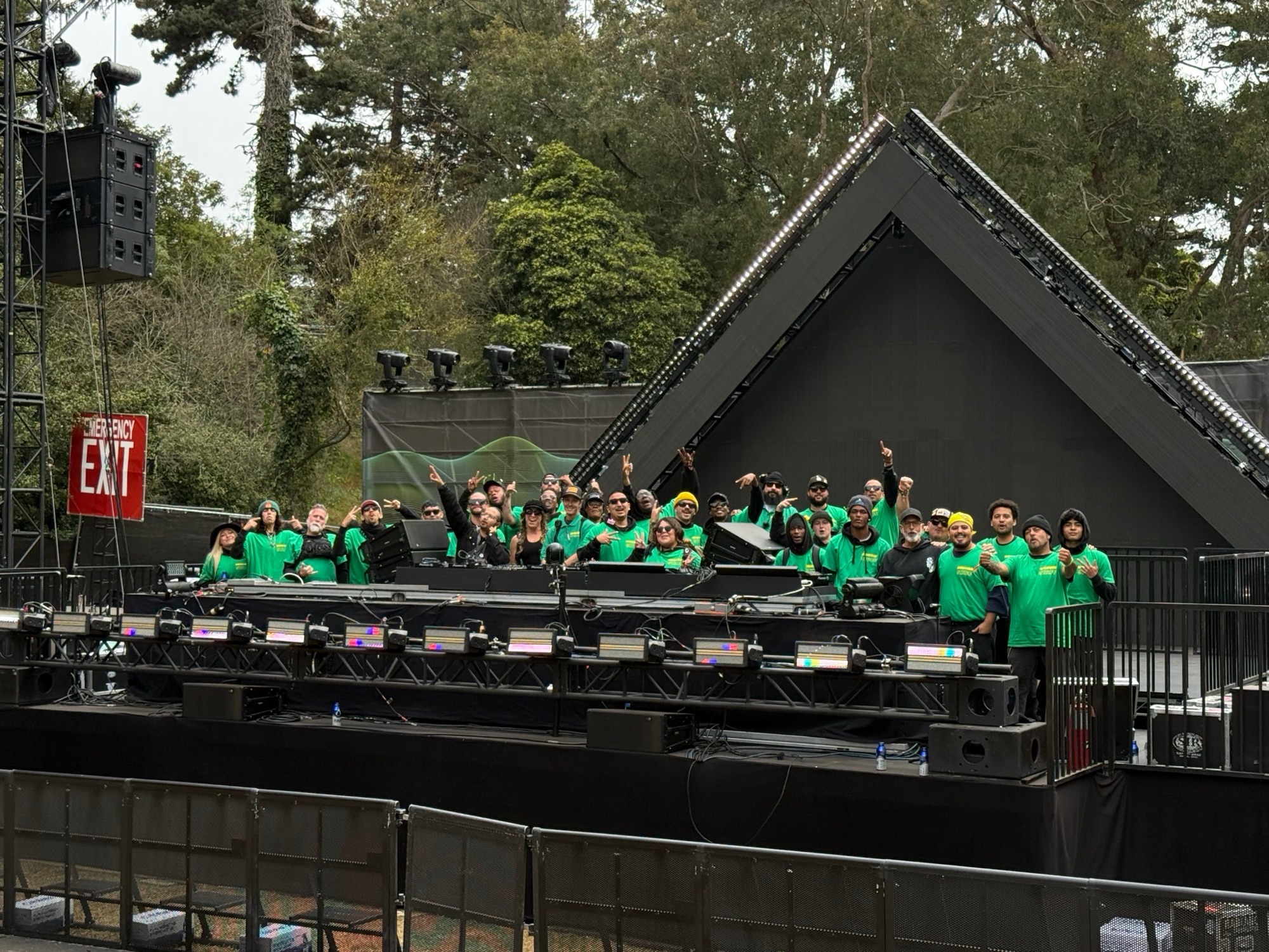 IEM event crew gathered in front of a festival stage